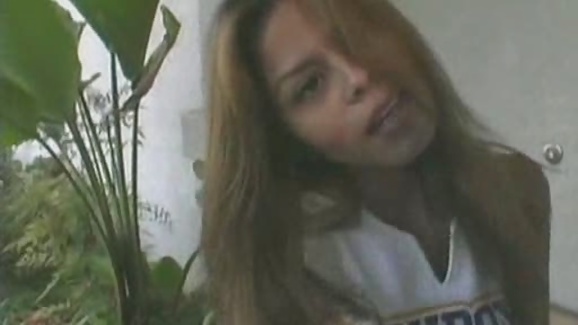 Cheerleader gets it on couch.